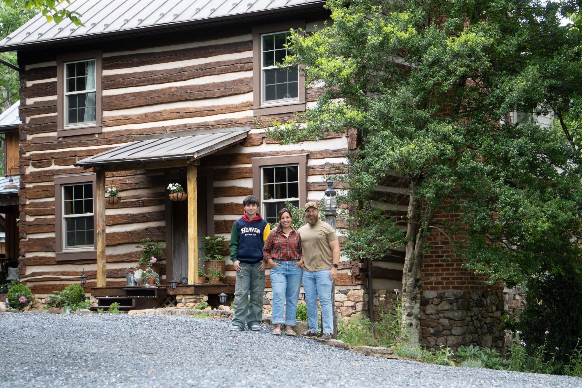 The family standing in front of the Tarry There farmhouse